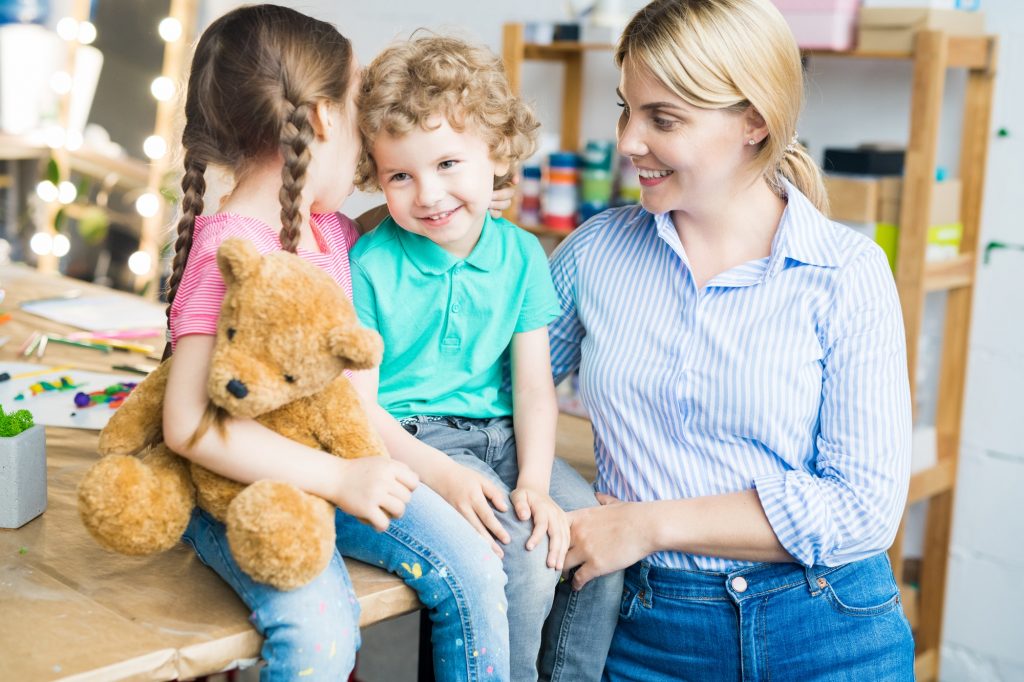 Happy Young Mother with Two Kids
