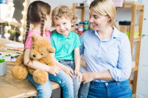 Happy Young Mother with Two Kids